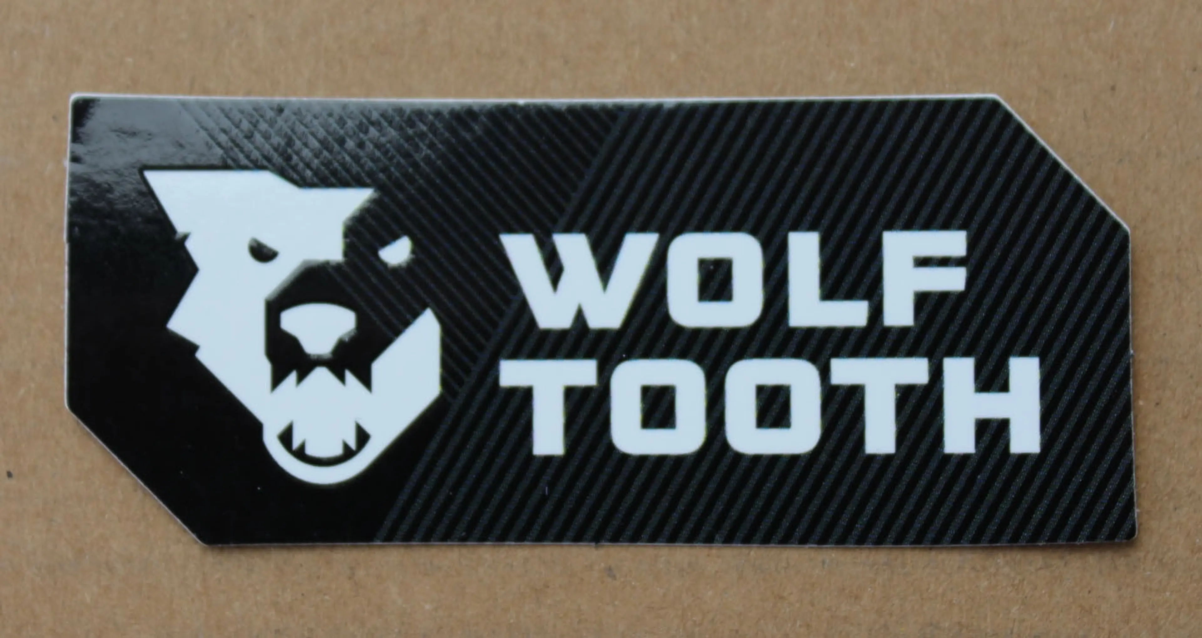 1. Wolf Tooth 77/32mm sticker - invert 2